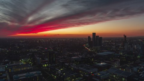 Establishing Aerial View Shot of Manchester UK, City Skyline England United Kingdom mega sunset, mesmerizing colors