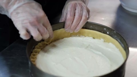 Female Hands Pouring Dough Into Form Baking Apple Pie.