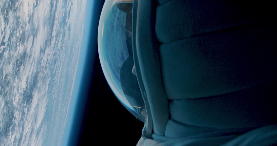 CU Portrait of Caucasian female astronaut during spacewalk on the Earth orbit. Space exploration, Mars mission. Shot with 2x anamorphic lens Royalty-Free Stock Footage #1089437149