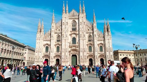 MILAN, ITALY - APRIL 19, 2022: People Walking In Piazza Del Duomo (Duomo Square) in Milan, Italy