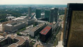 Aerial view of Downtown Kirchberg quarter of Luxembourg City. Court of Justice and Administrative Offices of European Union. Urban Cityscape with Skyscrapers. 4K drone panoramic establishing shot - Powered by Shutterstock - Get 15% off with code: PIKWIZARD15