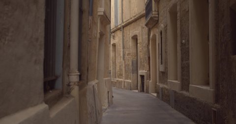 Empty Narrow Alley In Historic Town Of Montpellier In France. Medium Shot