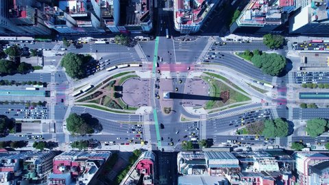 Buenos Aires, Buenos Aires, Argentina - 04.18.2022 - Timelapse aerial landscape of famous 9th July avenue at region of Obelisk monument. Time Lapse of Obelisk at downtown Buenos Aires Argentina.