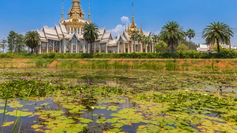 Temple time lapse Wat Non Kum with a lotus pond is considered a symbol of Buddhism. in Sikhio District, Nakhon Ratchasima Province, Thailand