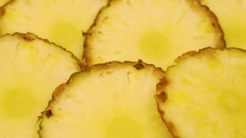 Juicy Yellow Slices of Sliced Pineapple, Fruit, Close-up, Rotation. Vegan Food Healthy Vitamin Diet, Pineapple Diet for Weight Loss. Background from Pineapple slices.