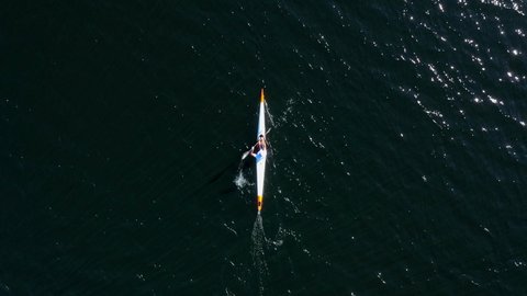 Top Down Aerial Kayaker Paddling on Lake, Zoom Out, Water Frame Fill