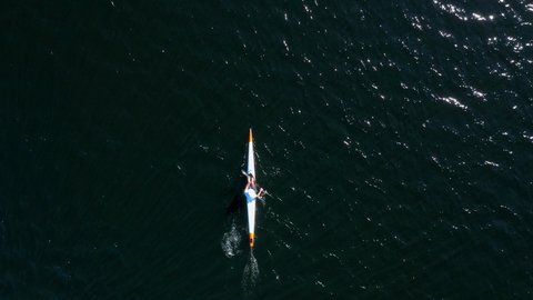 Top Down Aerial Kayaker Paddling on Lake, Kayak Tracking From Above