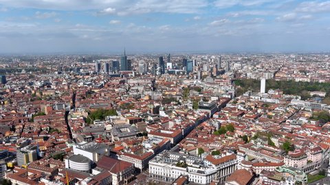 Aerial view of new Milan skyline, Italy. Panorama of Milano city with Porta Nuova futuristic business district. From above drone view of suburb downtown and cityscape with the tall modern buildings 6K