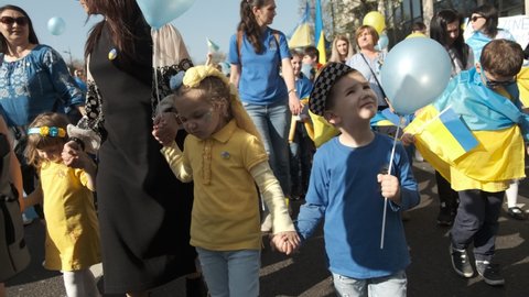 London, UK. 26th March 2022. Ukrainian children at the London Stands With Ukraine demonstration rally at Park Lane, London, in protest of President Vladimir Putin's Russian invasion of Ukraine.