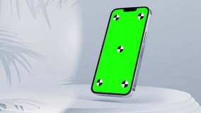 3d render of phone green screen with marks for tracking standing in a white studio with a shadow of leaves with screen reflections. Luma Matte