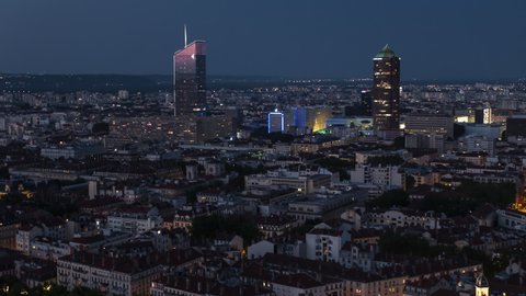Establishing Aerial View Shot of Lyon Fr, Auvergne-Rhone-Alpes, France at night evening, skyscrapers and last rays of sun