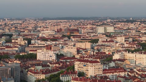 Establishing Aerial View Shot of Lyon Fr, Auvergne-Rhone-Alpes, France, busy city architecture in sunset light