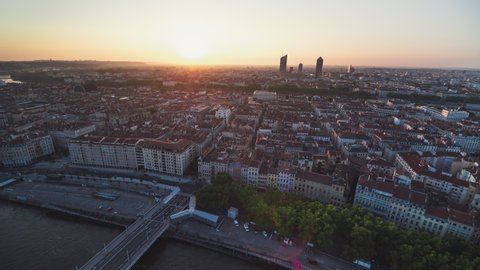 Establishing Aerial View Shot of Lyon Fr, Auvergne-Rhone-Alpes, France, sun wakes city
