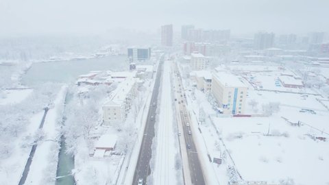 Aerial view of snowy Krasnodar city, winter landscapes in city.