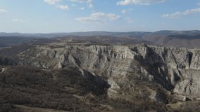 Aerial drone video over the hill mountain cliff with rocks of the Nisevac near Svrljig in Serbia in sunny day 