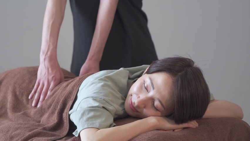 Japanese woman receiving a massage Royalty-Free Stock Footage #1089462205