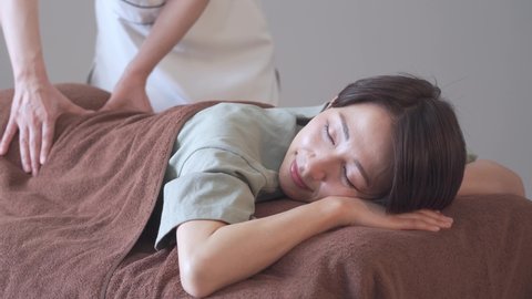 Japanese woman receiving a massage