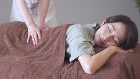 Japanese woman receiving a massage