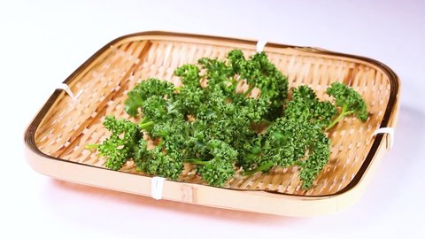 Fresh parsley on a colander rotating