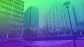 Animation of clock moving over cityscape in green and violet. business, city life and time concept digitally generated video.