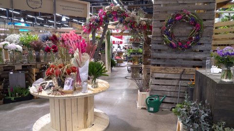 Helsinki, Finland - Apr 10, 2022: Customers buy plants at the Spring Fair Spring Garden the largest gardening event in the Nordic Countries about newest trends and the best tips for creating garden.