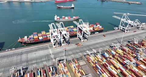 Rotterdam, 18th of april 2022, The Netherlands. Container terminal logistic ship loading and unloading of import and export dock commercial harbour aerial drone view. freight business