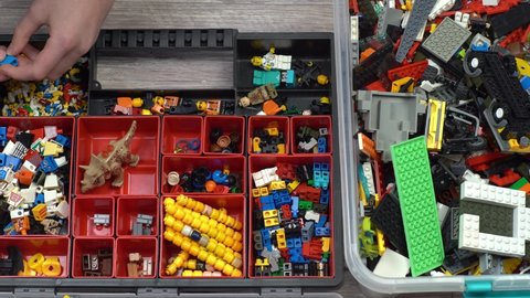 Lego. Children's toy constructor. Lots of colorful details. Blocks and bricks for playing and building. Educational toy. Lego figures. Sorting and storage. Play. Kyiv, Ukraine - March 30, 2022.