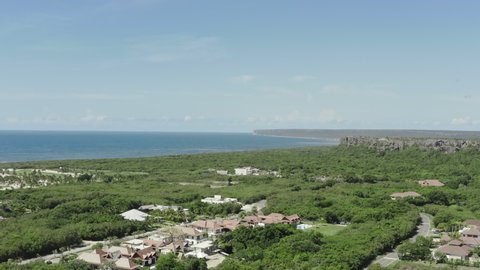 Aerial view of the nature of the Dominican Republic. Resort in the jungle by the ocean in a bounty bridge with beaches and waves.