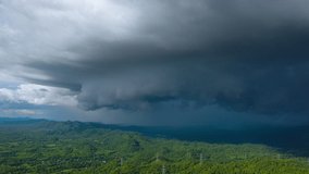 Hyperlapse Video 4K, Aerial view Summer Thunderstorm and Black clouds moved over the mountains at Late Afternoon, Mae Mo, Lampang,Thailand.