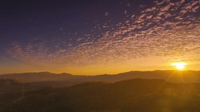 Hyper lapse video 4k motion, Beautiful Long exposure of morning sky cloudscape over fertile forest mountains. Pang Puai, Mae Moh, Lampang, Thailand.