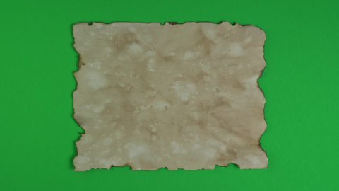Ancient parchment papers on green background for transparency, key color and chroma key. Old weathered burnt textured paper. Paper for calligraphy memoir records and book making.