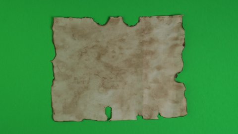 Ancient parchment papers on green background for transparency, key color and chroma key. Old weathered burnt textured paper. Paper for calligraphy memoir records and book making.