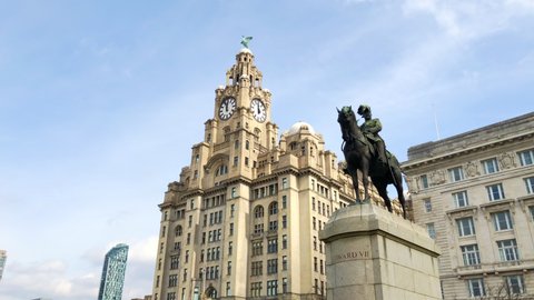 Liverpool, UK, April 16th 2022:The Royal Liver Building is a Grade I listed building in Liverpool, Merseyside. Located at the Pier Head waterfront. Also statue of Edward VII on horseback.