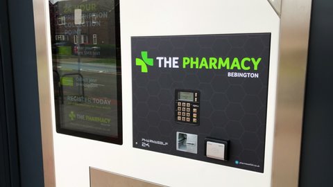 Bebington, UK, April 17th 2022:A new 24-hour automated prescription collection service in Bebington and the Wirral. The touch screen, keypad, card and dispenser. The Pharmacy, 176 Bebington Road CH63.