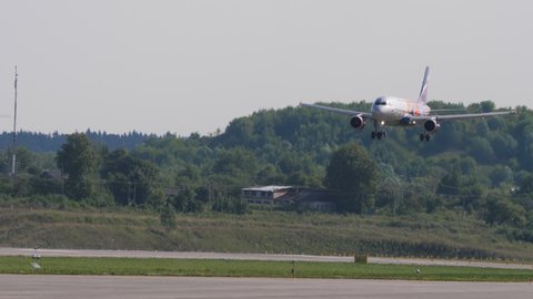 MOSCOW, RUSSIAN FEDERATION - JULY 31, 2021: Aeroflot Airbus A320 landing descent at Sheremetyevo Airport, side view