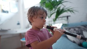 Two little boys playing flute musical tune together - Powered by Shutterstock - Get 15% off with code: PIKWIZARD15