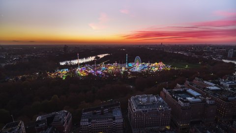 Colorful Sunset over posh part of City, Mayfair, Hyde Park, Winter Wonderland, Establishing Aerial View Shot of London UK, United Kingdom
