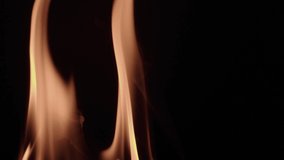 Natural wooden fire and flame on black background, warm orange burn wood. The smoke of the fire rises. Slow motion, filmed on high speed cinema camera, 8K downscale, 4K.