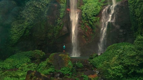 Waterfall in green rainforest. Aerial view of triple waterfall Sekumpul in the mountain jungle. Bali,Indonesia. Travel concept. Aerial footage.