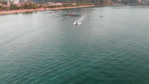 Forward Flying Drone Shot At Ao Nang Beach, Flying Over Boats As The Sun Sets. Krabi, Thailand