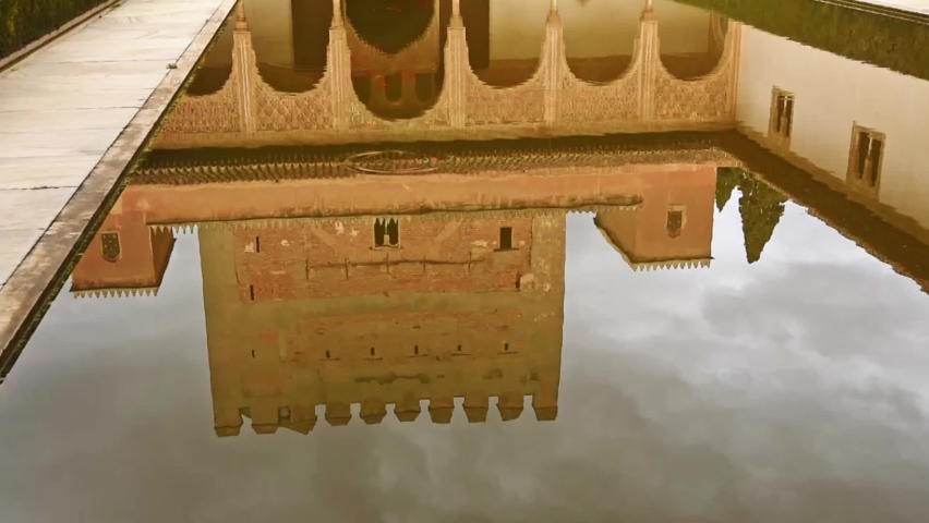 Court of the Myrtles within the walls of the Alhambra Palace, Granada Spain. Relfection