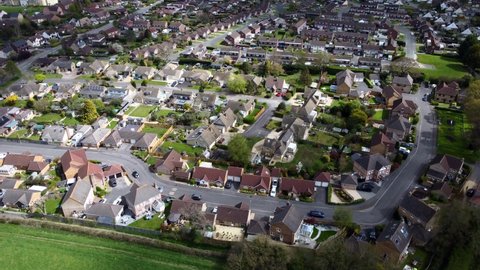 Top down aerial birds eye view of suburban town in Wiltshire, England