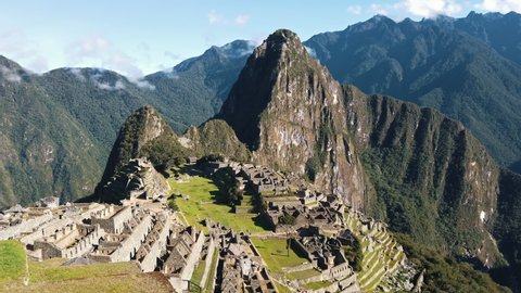 Machu Picchu, Ancient ruins of urban center, Peru. Pan right