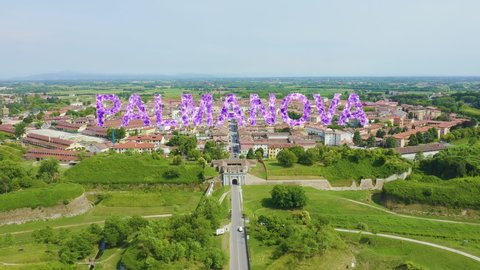 Inscription on video. Palmanova, Udine, Italy. An exemplary fortification project of its time was laid down in 1593. Shimmers in colors purple, Aerial View