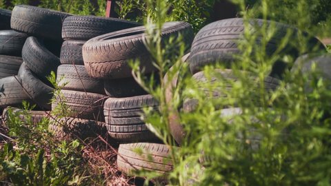 Car Tire Rubber Dump. Pile of Old Car Tyres Storage. Stack of Used Tires Junkyard. Heap Black Wheels Ecology Hazard. Environment Disaster Concept