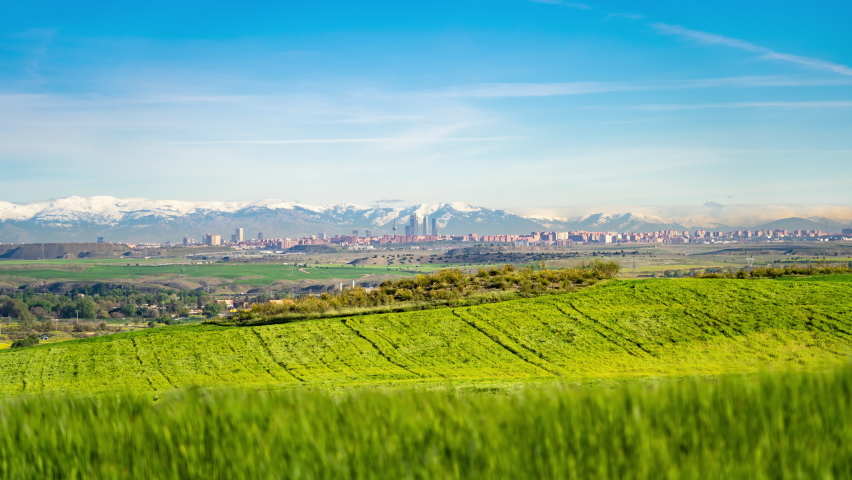 Timelapse of Madrid Centre Skyline and the Sierra covered in Snow
