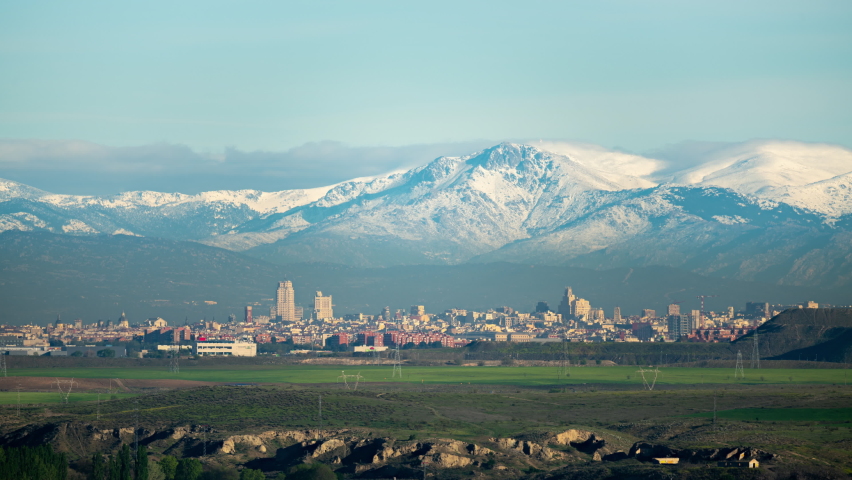 Timelapse of Madrid Centre Skyline and the Sierra covered in Snow