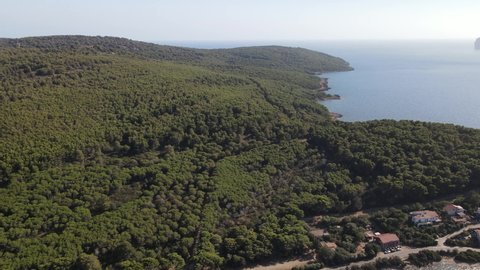 drone flight over the wild nature of the Capo Caccia natural park near Punta Giglio in Alghero