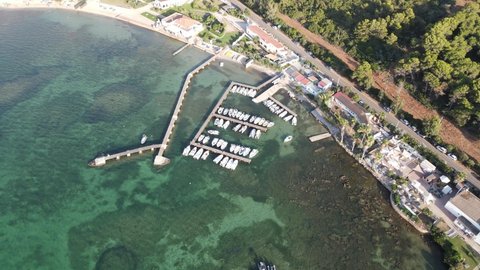 drone flight over the small and characteristic tourist port of Porto Conte near Alghero