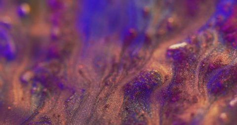 Glitter ink background. Paint mix. Shimmering liquid leak. Blur neon blue purple gold color shiny wet fluid flow motion abstract texture